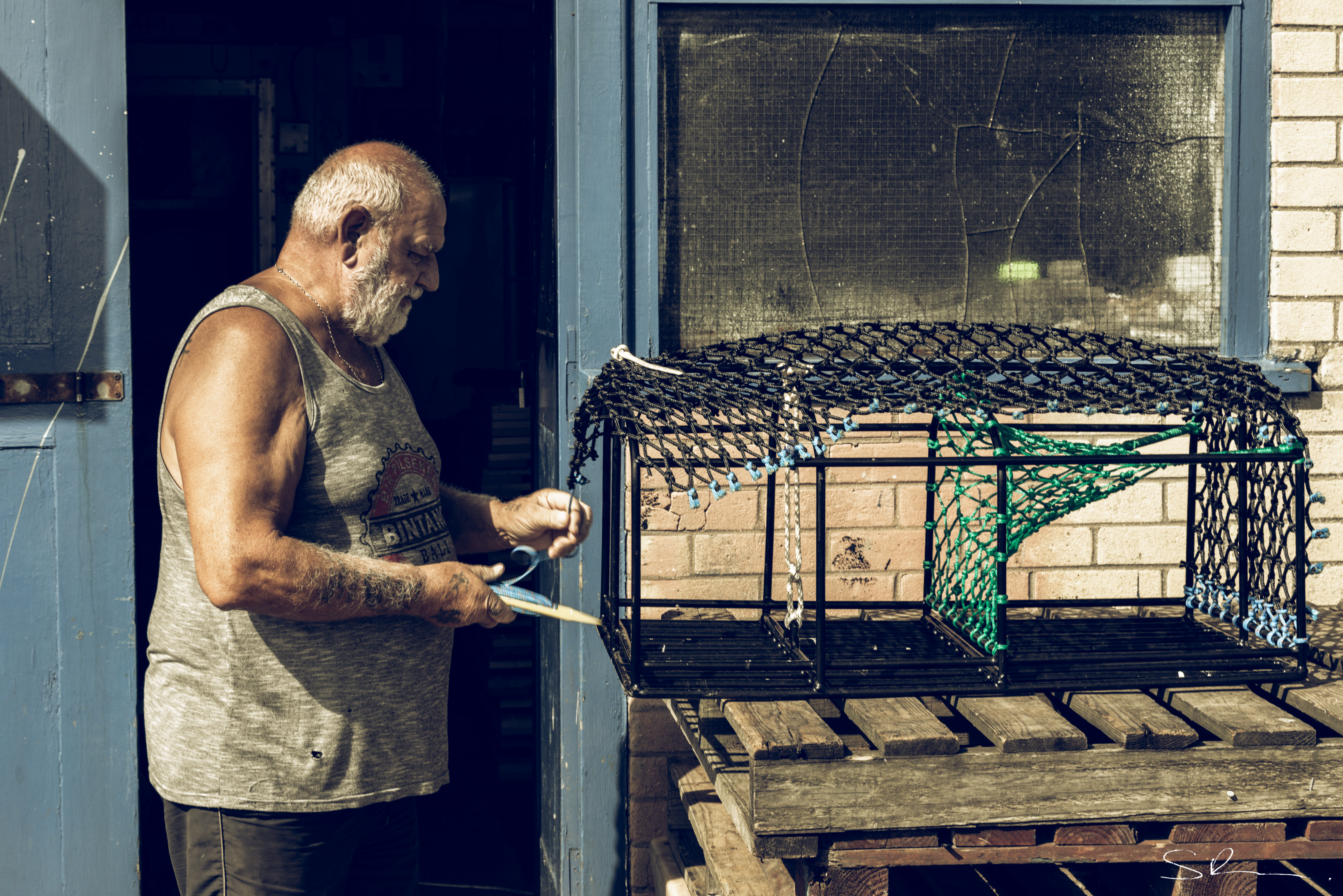 Fisherman Mending Pots